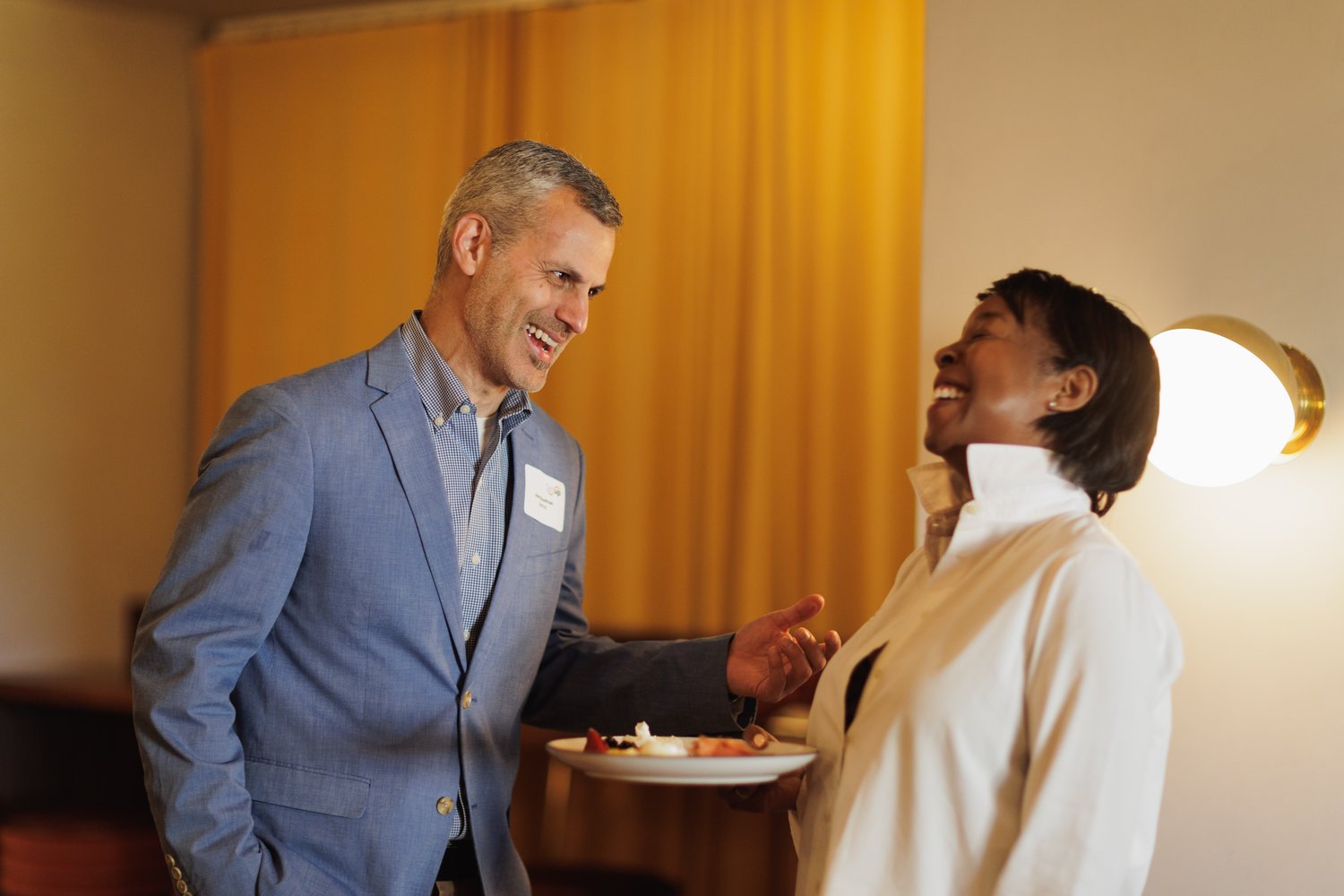 Networking event in Atlanta featuring professionals enjoying an exclusive brand-focused dinner, engaging in meaningful conversations, and building connections in a sophisticated setting.